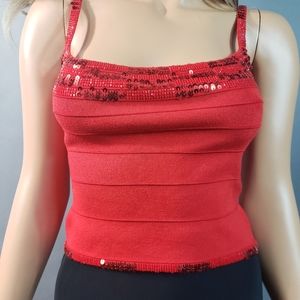 Alberto Makali Small red top 76% Silk , 21% Spandex, 3% Rayon. Beautiful color